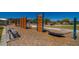 Community playground offering a climbing wall and hammock for creative play, with benches for relaxing in the sun at 18260 W Camino De Oro --, Surprise, AZ 85387