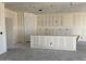 An unfinished room with drywall, concrete flooring, and a view of studs and electrical boxes at 18260 W Camino De Oro --, Surprise, AZ 85387