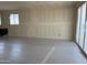 Bright living room featuring sliding glass doors and a window for ample natural light with plastic on the floor at 18261 W Camino De Oro --, Surprise, AZ 85387