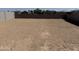 Expansive backyard with fresh dirt ready for a custom landscape design at 18265 W La Senda Dr, Surprise, AZ 85387