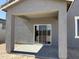 Covered patio with concrete flooring provides a great outdoor living space at 18265 W La Senda Dr, Surprise, AZ 85387