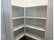 Walk-in pantry with white shelves for ample storage space at 18265 W La Senda Dr, Surprise, AZ 85387