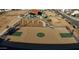 Features a community basketball court and playground with picnic tables in well landscaped green space at 18271 W La Senda Dr, Surprise, AZ 85387
