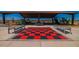 Large chess/checker board in the park with benches providing a place to play in this Gathering-friendly community at 18271 W La Senda Dr, Surprise, AZ 85387