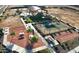 Community park with playground, tennis court, picnic tables, and grassy area for recreation at 18271 W La Senda Dr, Surprise, AZ 85387