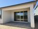 Covered patio area with sliding glass door at 18271 W La Senda Dr, Surprise, AZ 85387