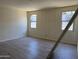 Sunlit bedroom with tile flooring, neutral walls, and bright windows at 18272 W Camino De Oro --, Surprise, AZ 85387