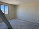 Bedroom featuring a bright window, neutral walls, and modern finishes at 18272 W Camino De Oro --, Surprise, AZ 85387
