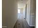 Hallway showing tile floors, neutral walls, and an open-concept layout at 18272 W Camino De Oro --, Surprise, AZ 85387