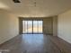 Bright open living space with sliding glass doors that provide outdoor access at 18272 W Camino De Oro --, Surprise, AZ 85387
