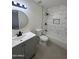 Contemporary bathroom featuring a shower with marble tile surround, modern sink, and vanity at 18629 N 4Th Dr, Phoenix, AZ 85027
