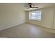 Bright bedroom with light tile flooring and a ceiling fan for added comfort at 18629 N 4Th Dr, Phoenix, AZ 85027