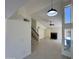 Open-concept living room with fireplace and staircase, great for entertaining at 18629 N 4Th Dr, Phoenix, AZ 85027