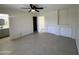Spacious main bedroom with tile flooring, ceiling fan, adjacent bathroom, and plenty of storage space at 18629 N 4Th Dr, Phoenix, AZ 85027
