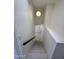 Clean stairway with modern lighting, offering a stylish transition between levels at 18629 N 4Th Dr, Phoenix, AZ 85027