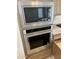 Gleaming stainless steel KitchenAid microwave and oven at 18717 N 267Th Dr, Buckeye, AZ 85396