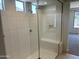 This luxurious bathroom features a glass-enclosed shower with a built-in bench and showerhead at 18717 N 267Th Dr, Buckeye, AZ 85396