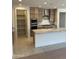 Spacious kitchen featuring stainless steel appliances, ample cabinet space, and a large kitchen island at 18717 N 267Th Dr, Buckeye, AZ 85396
