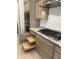 Modern kitchen features stainless steel appliances, sleek cabinetry, and granite countertops at 18717 N 267Th Dr, Buckeye, AZ 85396