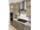 Modern kitchen features stainless steel appliances, sleek cabinetry, and granite countertops at 18717 N 267Th Dr, Buckeye, AZ 85396