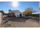 Gravel backyard with metal fence and desert landscaping at 1950 W Palm Ln, Phoenix, AZ 85009