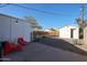 This backyard has gravel, a small outdoor shed, and is fully fenced at 1950 W Palm Ln, Phoenix, AZ 85009