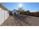 Backyard offers gravel, a wood fence, and plenty of room at 1950 W Palm Ln, Phoenix, AZ 85009