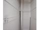 Clean, bright closet with white walls, hanging rods, and a white decorative chair rail at 1950 W Palm Ln, Phoenix, AZ 85009