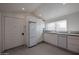 Bright kitchen featuring modern appliances, white cabinets, and granite countertops with a window at 1950 W Palm Ln, Phoenix, AZ 85009