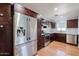 Modern kitchen with stainless steel appliances, dark wood cabinetry, and bright countertops at 1950 W Palm Ln, Phoenix, AZ 85009