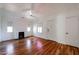 Bright living room with hardwood floors, fireplace, and ample natural light from the windows at 1950 W Palm Ln, Phoenix, AZ 85009