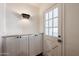 Convenient mudroom features built-in storage cabinets and a bright door at 1950 W Palm Ln, Phoenix, AZ 85009