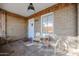 Charming porch featuring brick walls, modern transparent chairs, and an inviting entrance with a small table at 1950 W Palm Ln, Phoenix, AZ 85009