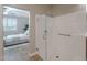 Modern shower with glass door in bathroom connected to the primary bedroom at 20641 W College Dr, Buckeye, AZ 85396
