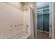 Clean, neutral bathroom with a shower/tub combo and a view of the closet at 20641 W College Dr, Buckeye, AZ 85396
