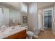 Light-filled bathroom featuring a vanity, toilet, and shower/tub combination at 20641 W College Dr, Buckeye, AZ 85396