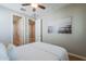 Bright bedroom featuring a serene ambiance and open doorways to the bathroom and closet at 20641 W College Dr, Buckeye, AZ 85396