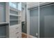 Spacious closet boasts custom shelving, drawers, and ample storage for an organized wardrobe at 20641 W College Dr, Buckeye, AZ 85396