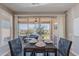 Cozy dining area featuring stylish furniture and large glass doors for outdoor access at 20641 W College Dr, Buckeye, AZ 85396