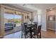 Bright breakfast nook adjacent to the patio, with sliding glass doors and stylish dining set at 20641 W College Dr, Buckeye, AZ 85396