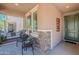 Inviting front porch with stone accents, seating, and views of the neighborhood at 20641 W College Dr, Buckeye, AZ 85396