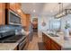 Spacious kitchen with stainless steel appliances, granite countertops, and an open layout at 20641 W College Dr, Buckeye, AZ 85396