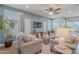 Comfortable living room with neutral tones, a ceiling fan, and stylish decorations at 20641 W College Dr, Buckeye, AZ 85396