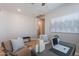 Cozy office featuring a stylish desk, comfortable seating, and tasteful decor at 20641 W College Dr, Buckeye, AZ 85396