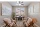 Stylish home office with modern desk, neutral decor, and plenty of natural light at 20641 W College Dr, Buckeye, AZ 85396