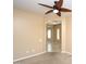 Beige bedroom featuring a ceiling fan and an open doorway at 2213 W Marconi Ave, Phoenix, AZ 85023