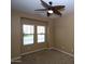 Neutral bedroom featuring a ceiling fan and natural light streaming through the windows at 2213 W Marconi Ave, Phoenix, AZ 85023