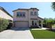 Beautiful two-story stucco home with a two-car garage, manicured landscaping, and inviting entryway at 2213 W Marconi Ave, Phoenix, AZ 85023