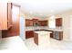 Modern kitchen featuring stainless steel appliances, granite countertops, and a center island at 2213 W Marconi Ave, Phoenix, AZ 85023
