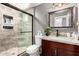 Bathroom featuring glass enclosed shower, granite countertop, and vanity with dark wood cabinets at 2221 N Richland St, Phoenix, AZ 85006